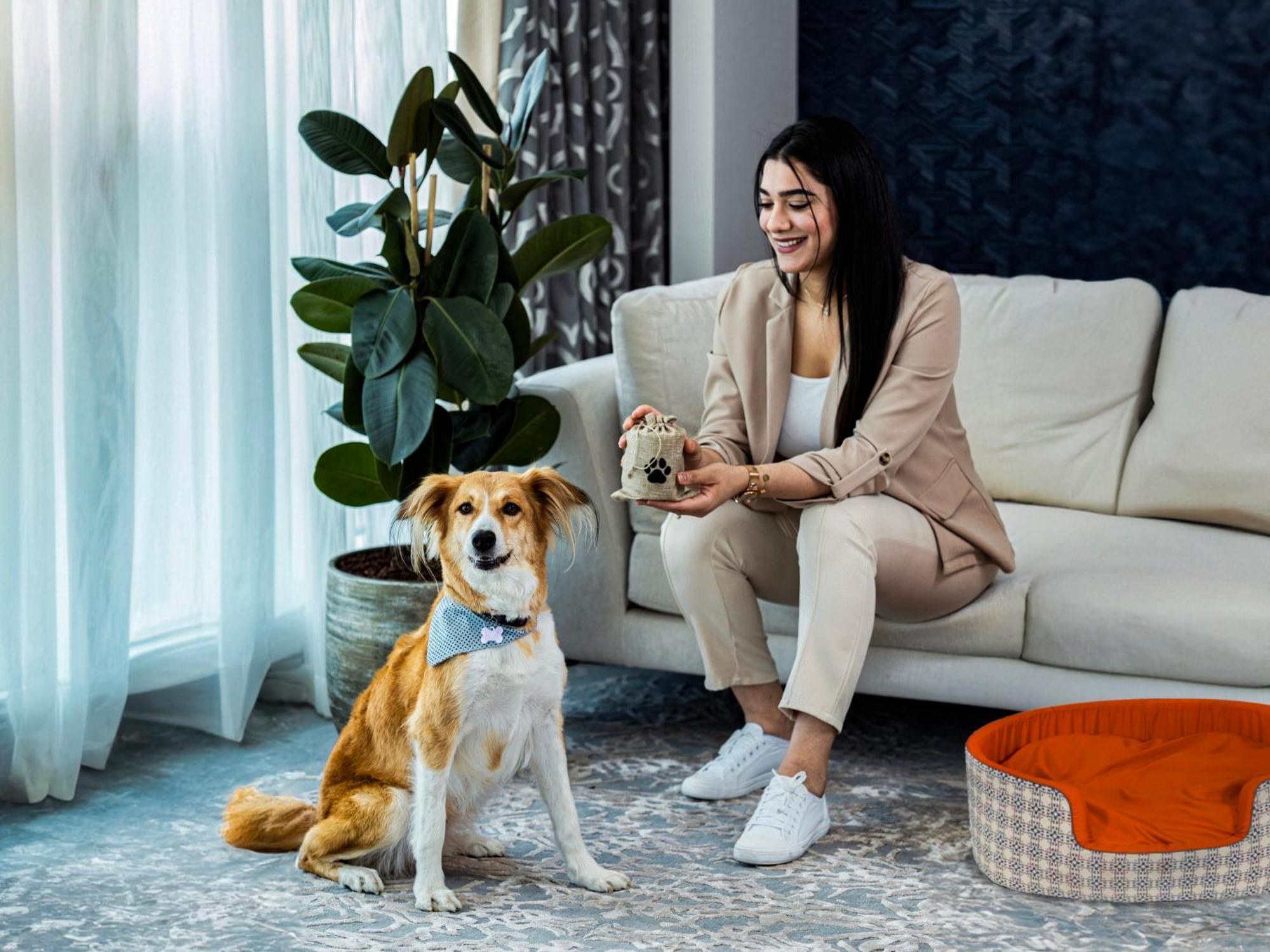 Abesq Doha Hotel And Residences, An Ihg Hotel Екстер'єр фото A dog with its owner